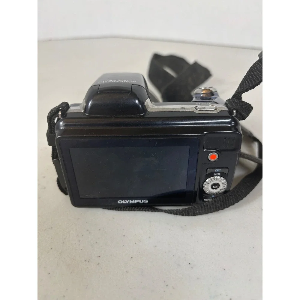 Olympus‎ SP 810UZ 14 Megapixel Digital Camera Black with Strap - Parts Only